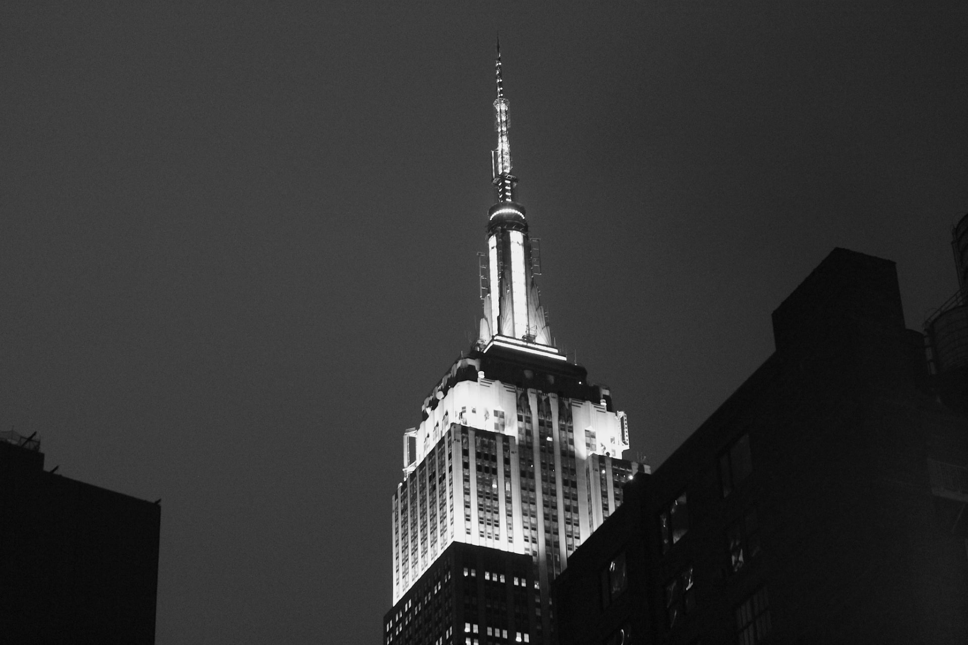 The Empire State Building lit at night.